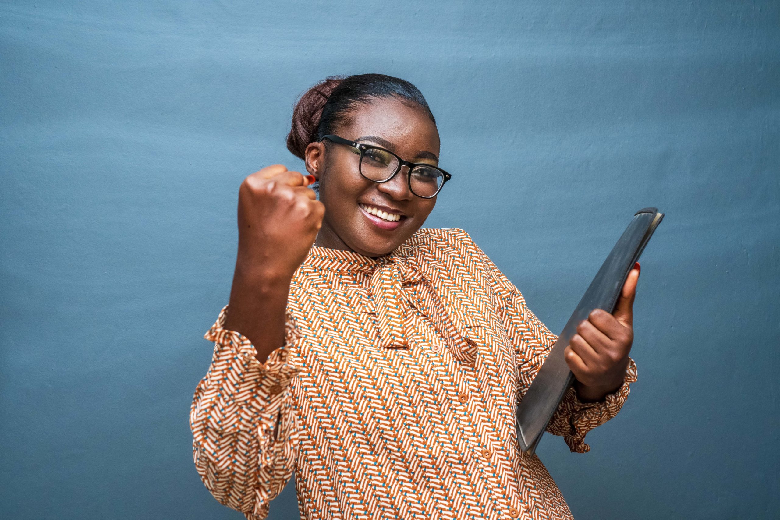 young african american female gesturing with her fist female empowerment concept